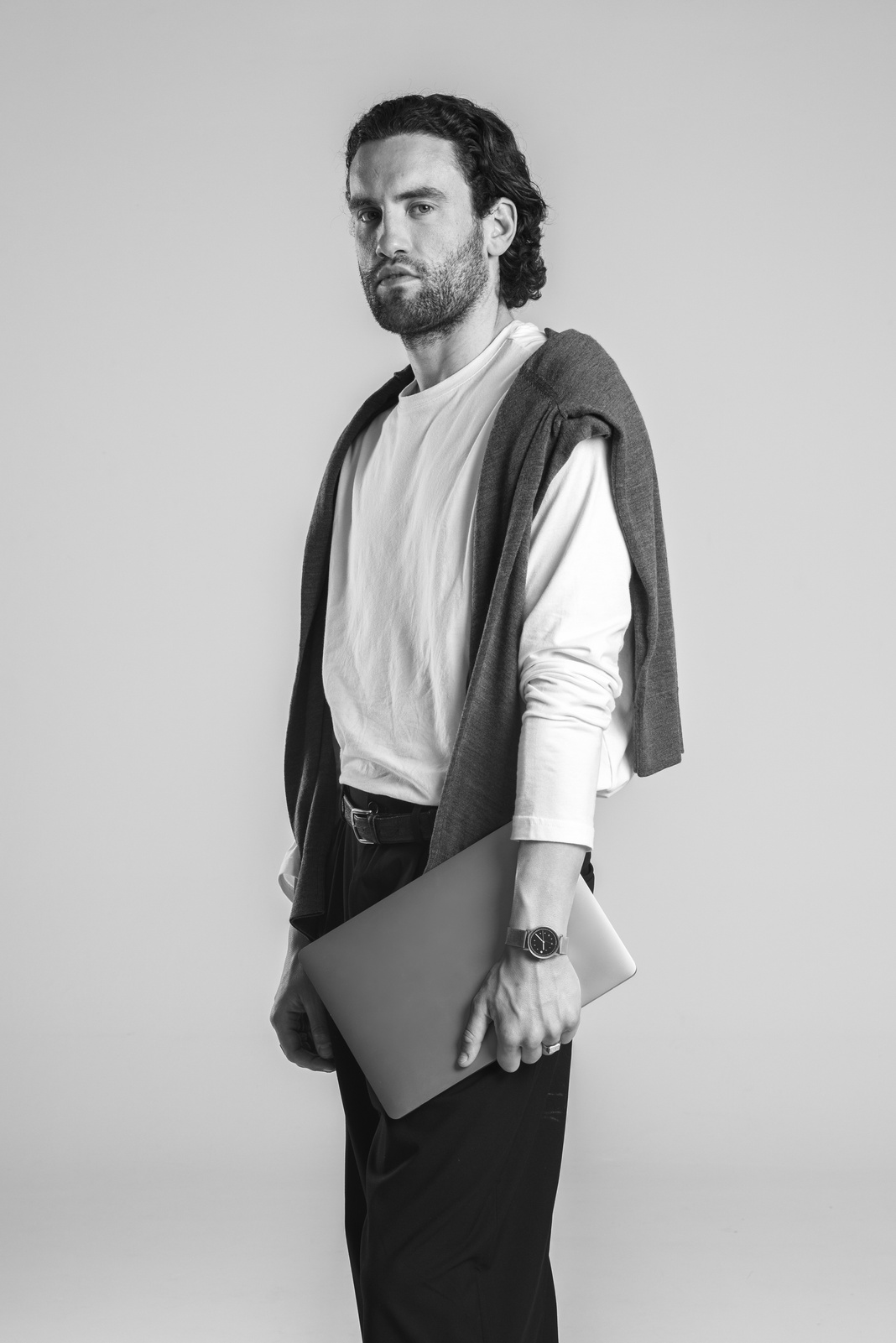 Stylish Man Holding a Laptop