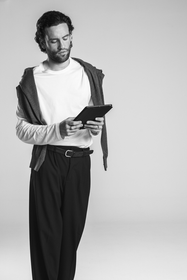 Stylish Man Using a Digital Tablet