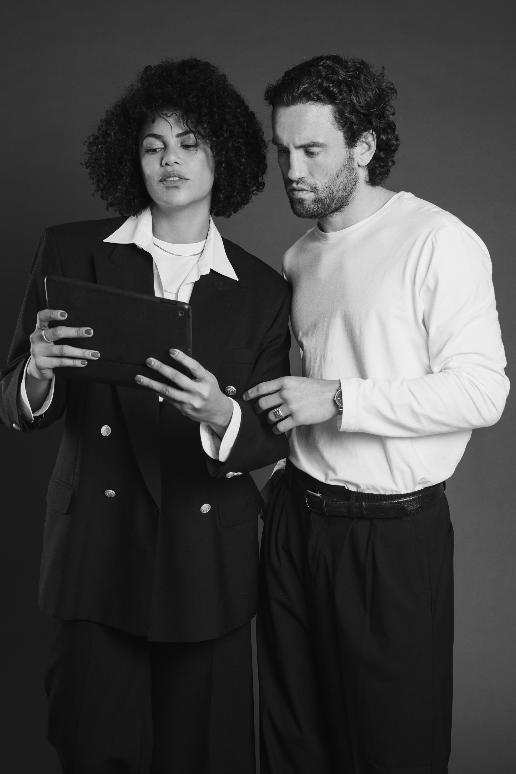 Stylish Couple Using a Digital Tablet