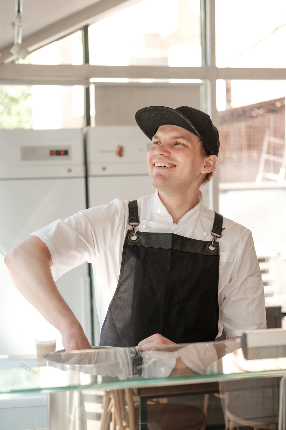 Restaurant Worker Standing Behind the Counter