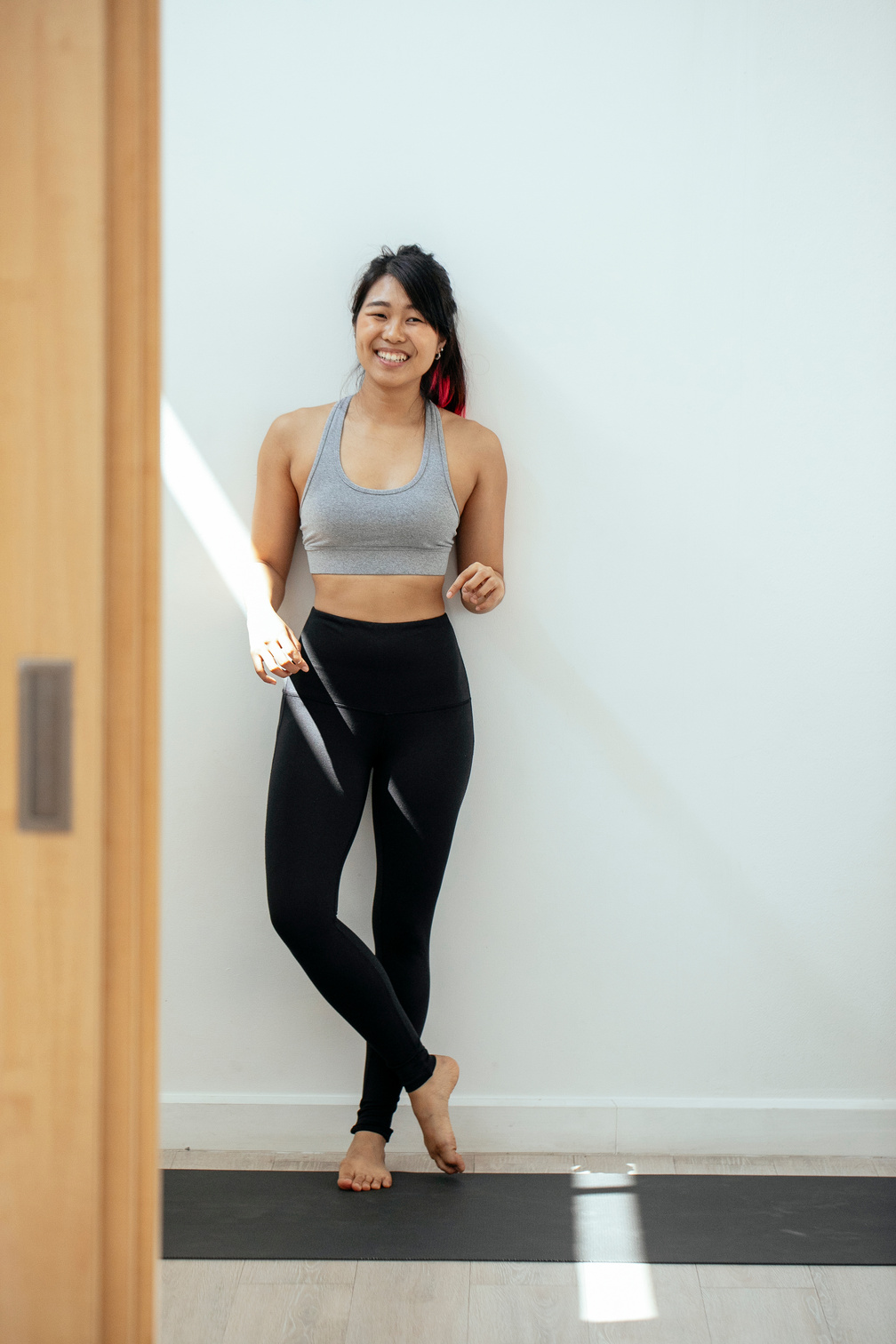 Smiling Woman in Yoga Clothing 